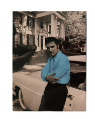 Elvis Magnet beside car blue shirt